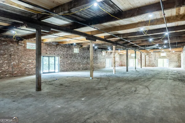 a view of a room with wooden walls