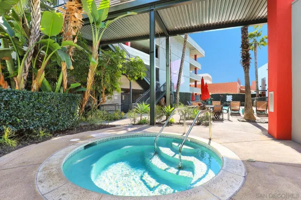 a view of a swimming pool with sitting area