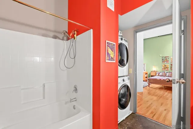 a bathroom with a sink a mirror and shower