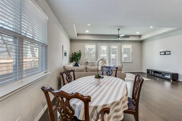 a view of a dining room with furniture and window
