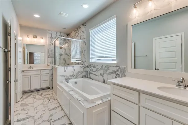 a bathroom with a sink and a bathtub