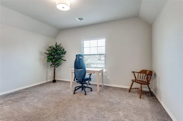 a workspace with furniture and a window