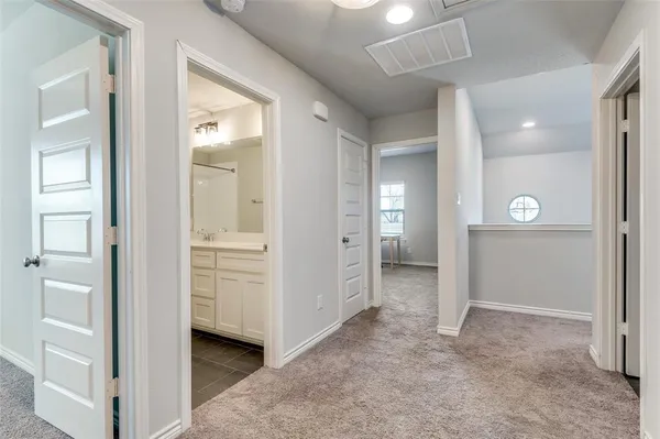 wooden floor with white walls