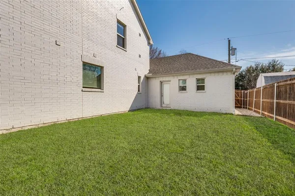 a view of a backyard with potted plants