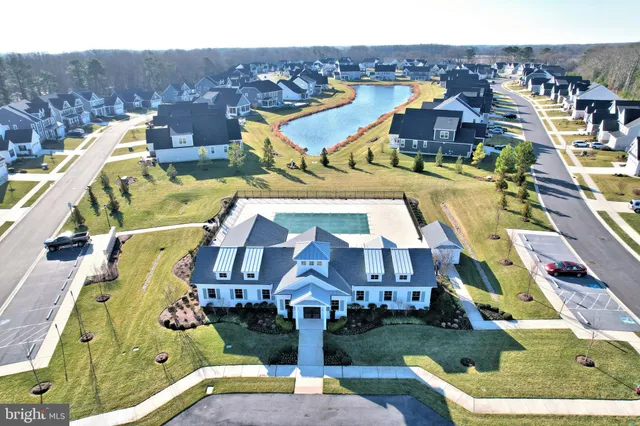 an aerial view of houses with a swimming pool