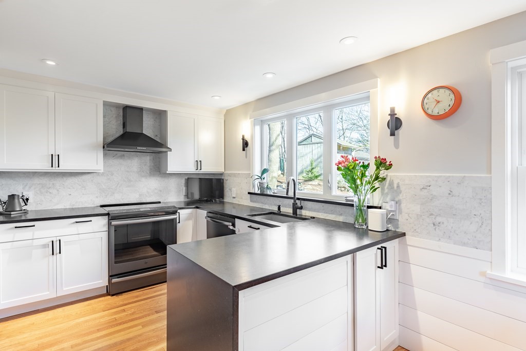 4 Abernathy Way Marblehead, MA 01945 - Photo 8 of 28 a kitchen with stainless steel appliances granite countertop a sink stove and refrigerator