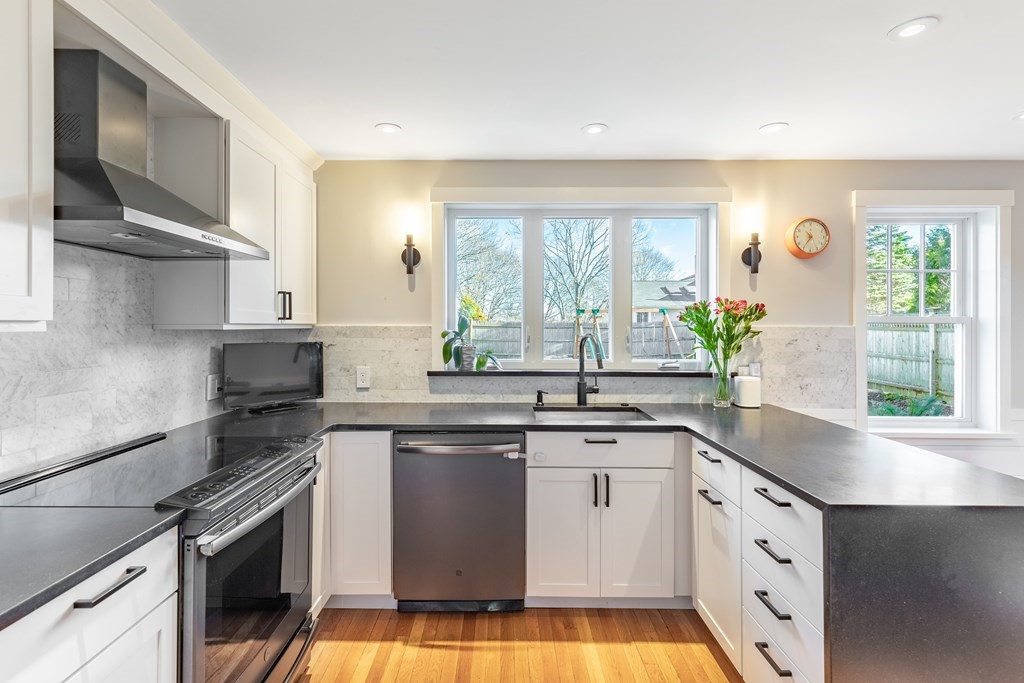 4 Abernathy Way Marblehead, MA 01945 - Photo 9 of 28 a kitchen with a sink stove and cabinets