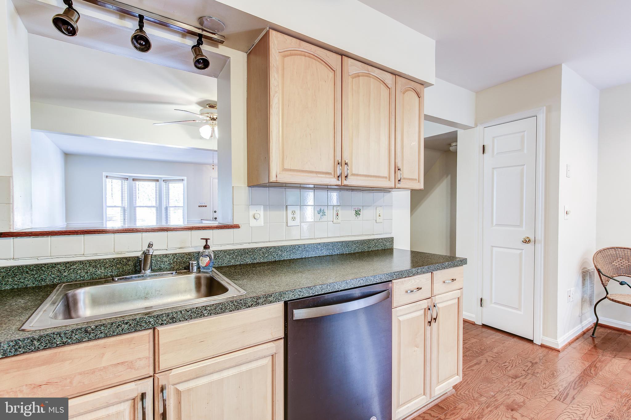 1119 Ingate Road Halethorpe, MD 21227 - Photo 13 of 34 Kitchen w Pass Through to Dining Area