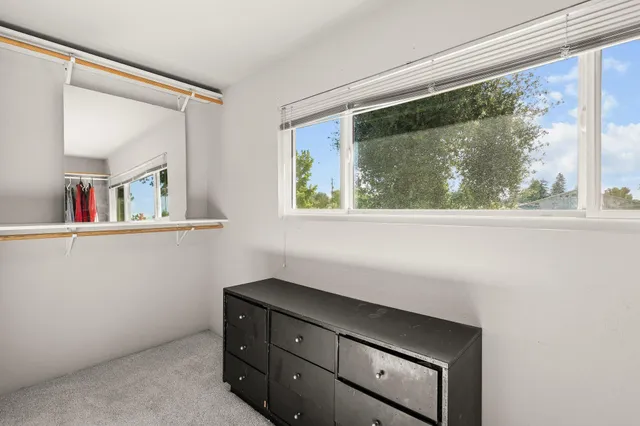 a room with a cabinet and a window