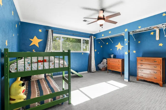 a bedroom with furniture and a window