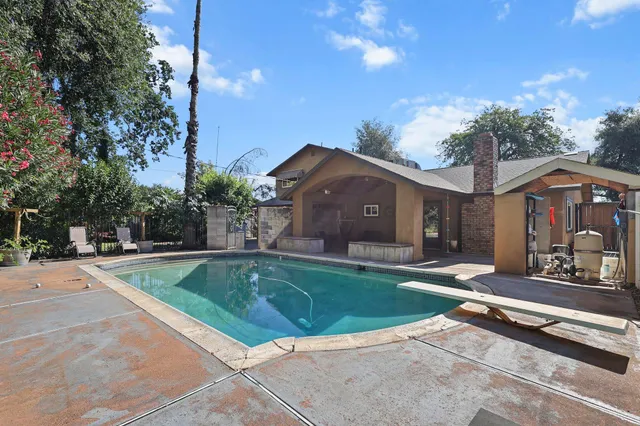 a view of a house with a swimming pool