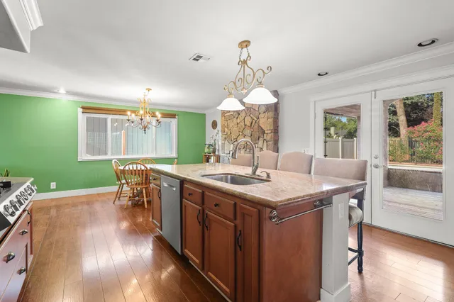 a kitchen with a table and chairs in it