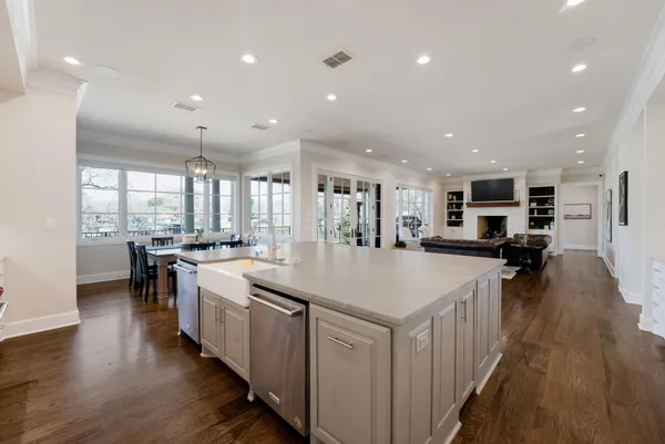 a large kitchen with stainless steel appliances lots of counter space