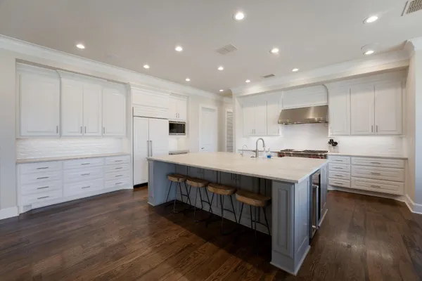 a kitchen with stainless steel appliances sink microwave and cabinets
