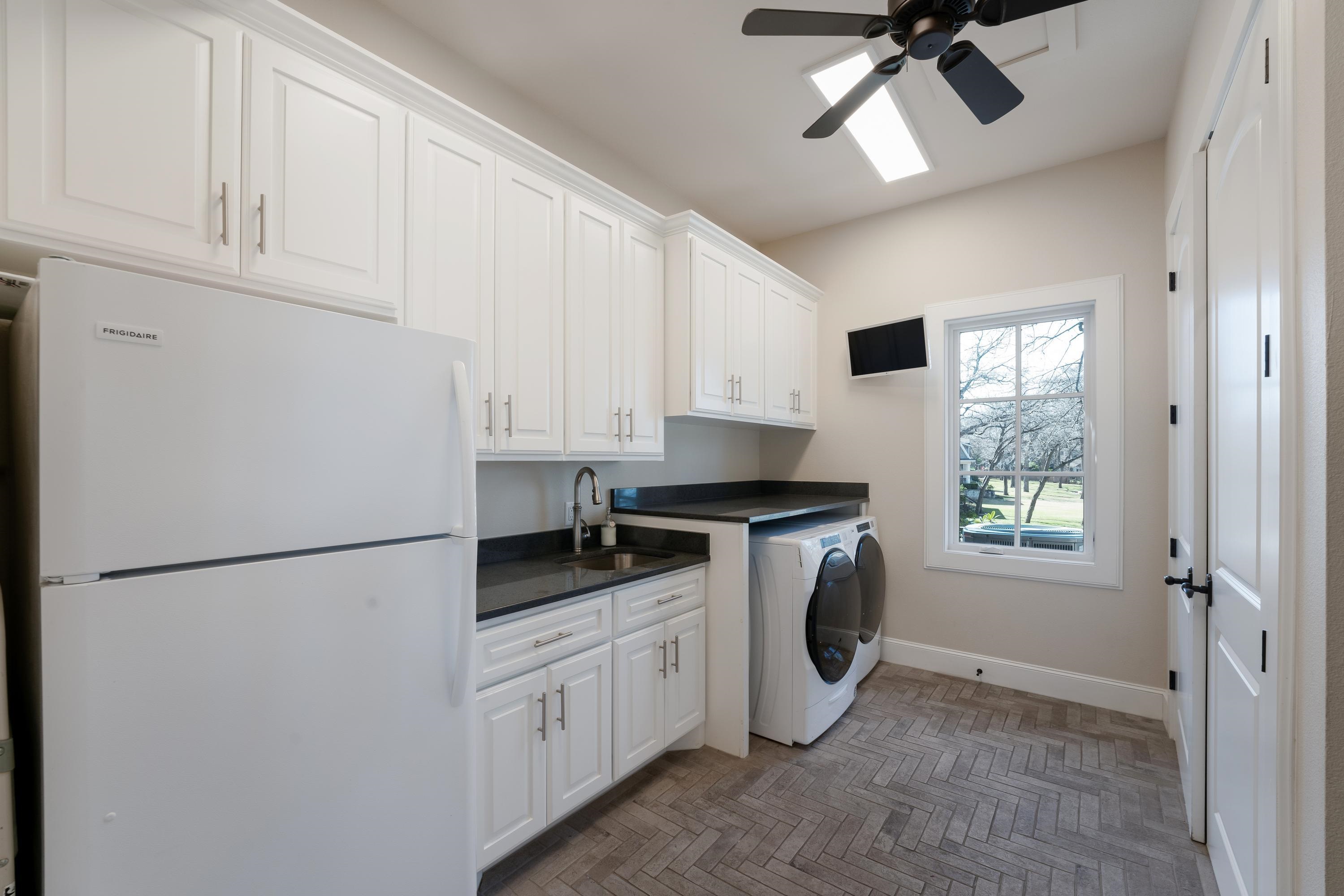 232 Laguna Rio Seguin, TX 78155 - Photo 20 of 30 a kitchen with stainless steel appliances a refrigerator sink and cabinets