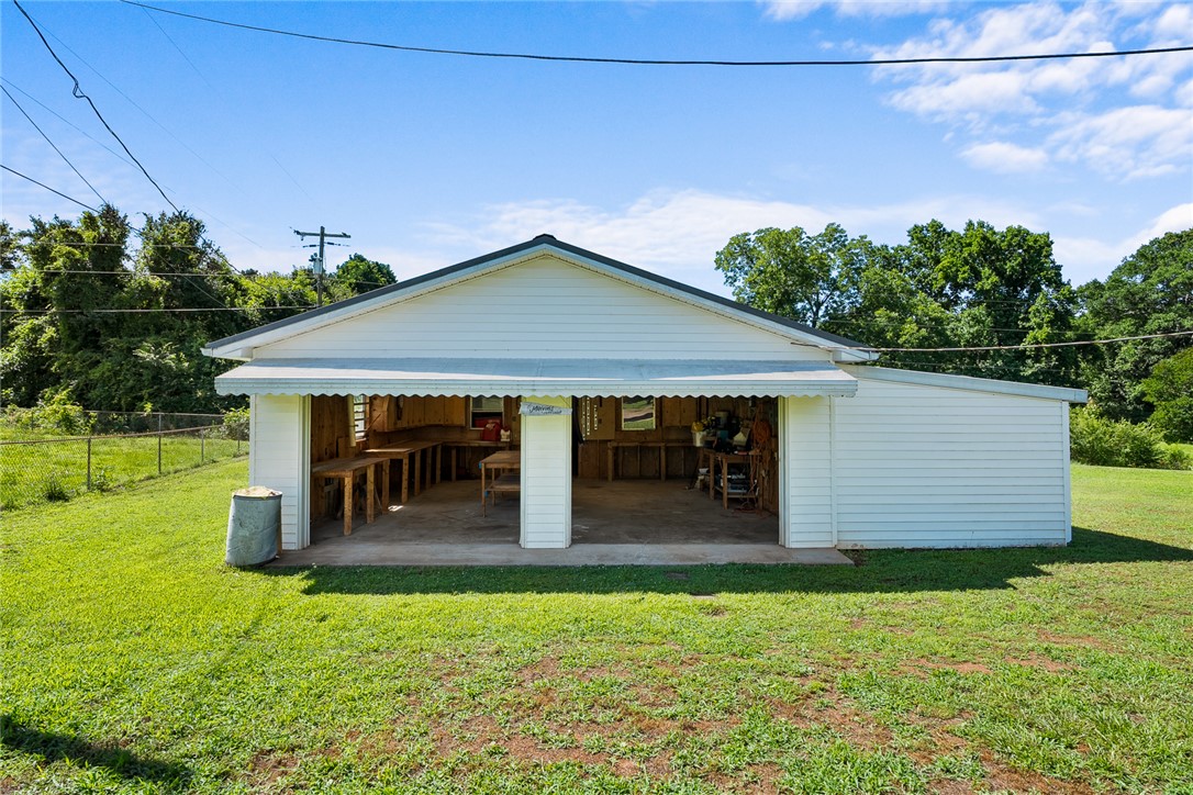 312 Edwards Drive Anderson, SC 29626 - Photo 29 of 44 A versatile outbuilding provides ample workspace with built-in counters, perfect for hobbies or storage.