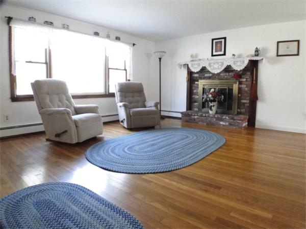 16 Herring Run Road Sandwich, MA 02537 - Photo 11 of 29 a living room with furniture and a fireplace