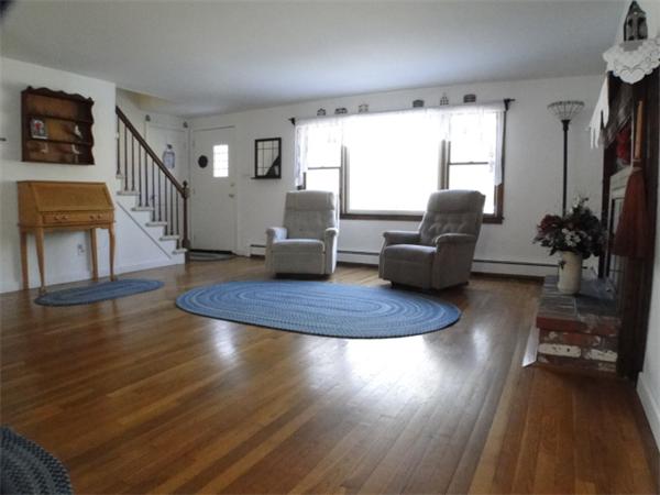 16 Herring Run Road Sandwich, MA 02537 - Photo 12 of 29 a living room with furniture and a wooden floor