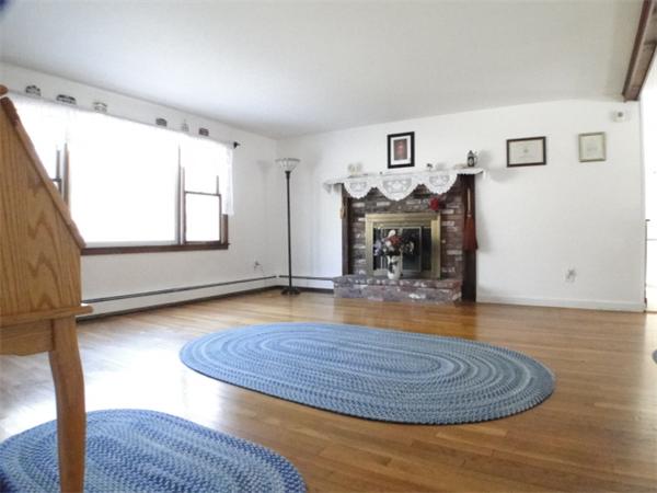 16 Herring Run Road Sandwich, MA 02537 - Photo 13 of 29 a view of livingroom with furniture window and wooden floor