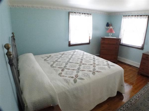 16 Herring Run Road Sandwich, MA 02537 - Photo 22 of 29 a bedroom with a bed and a window
