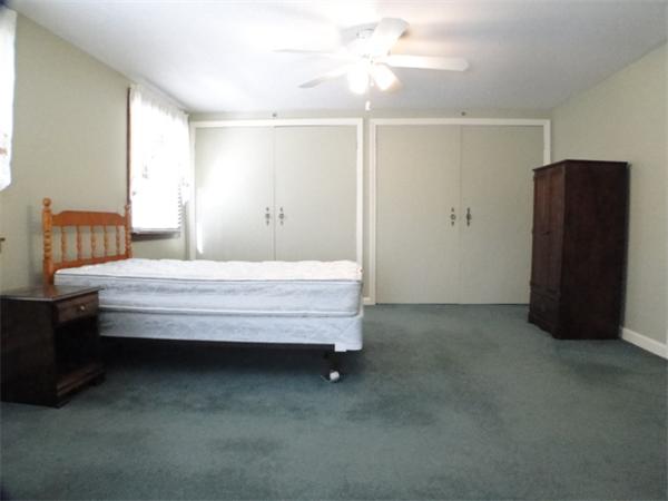 16 Herring Run Road Sandwich, MA 02537 - Photo 23 of 29 a bedroom with a bed and a cabinets