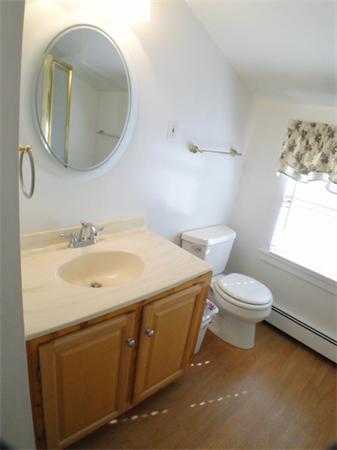 16 Herring Run Road Sandwich, MA 02537 - Photo 25 of 29 a spacious bathroom with a toilet sink and mirror