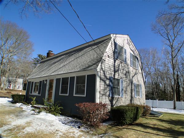 16 Herring Run Road Sandwich, MA 02537 - Photo 8 of 29 a view of a house with a yard