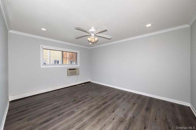 65 Friendly Court, Unit FC65 Babylon, NY 11702 - Photo 5 of 8 an empty room with wooden floor and windows