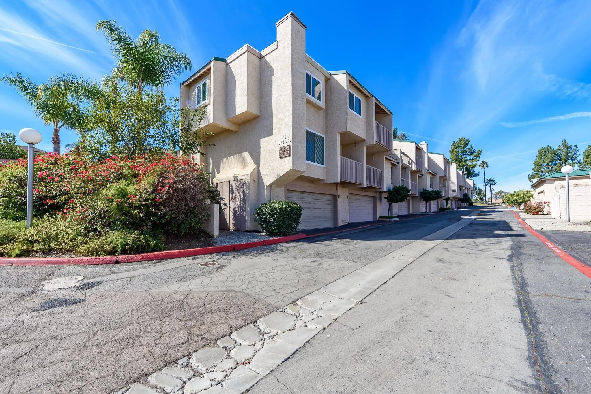 a view of a street with houses on both side
