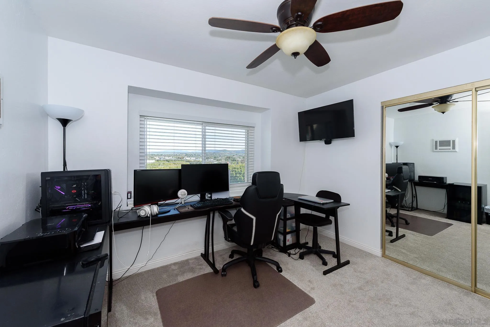 712 Silver Drive Vista, CA 92083 - Photo 20 of 32 a view of a workspace with furniture and a window