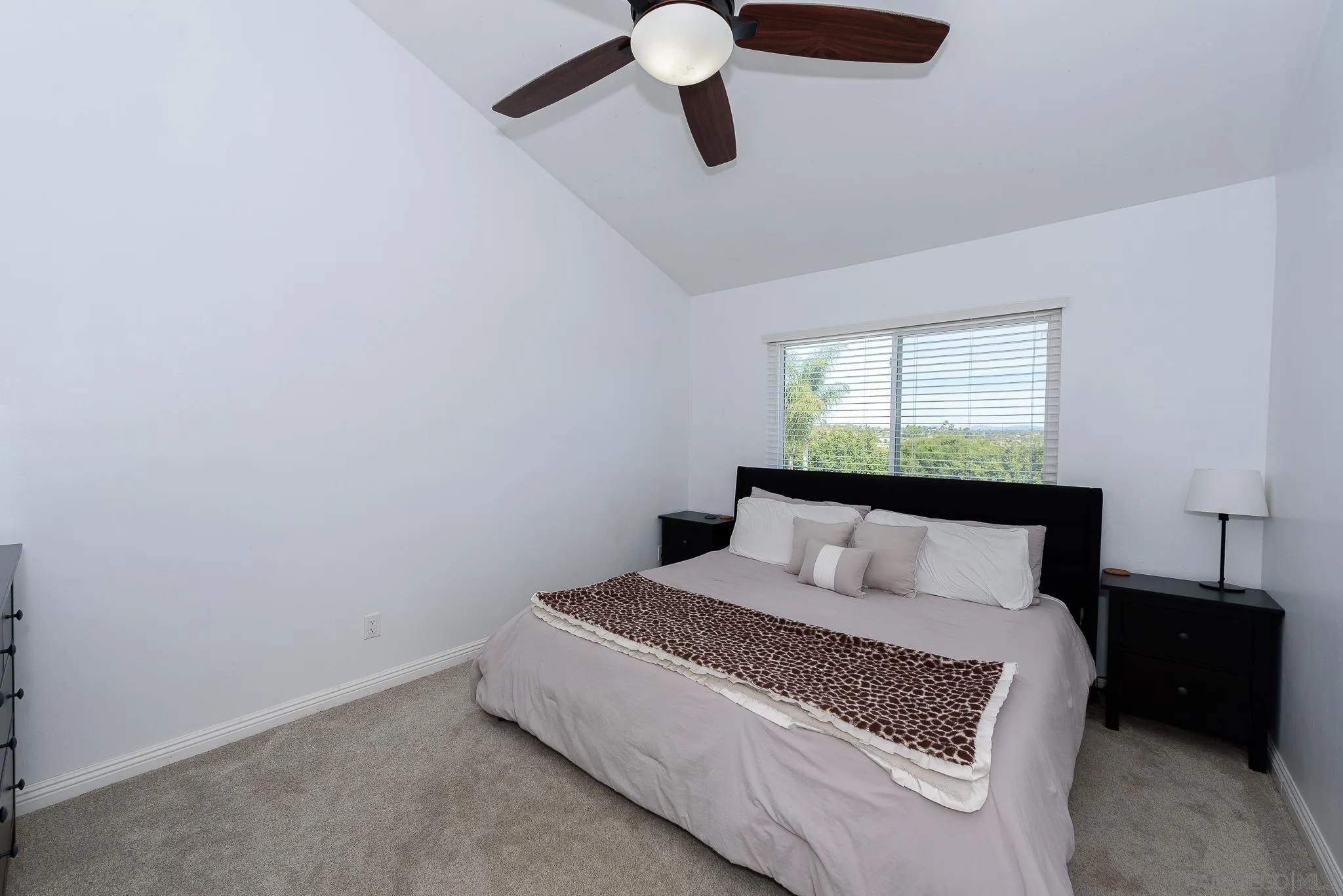 712 Silver Drive Vista, CA 92083 - Photo 21 of 32 a bedroom with a large bed and a window