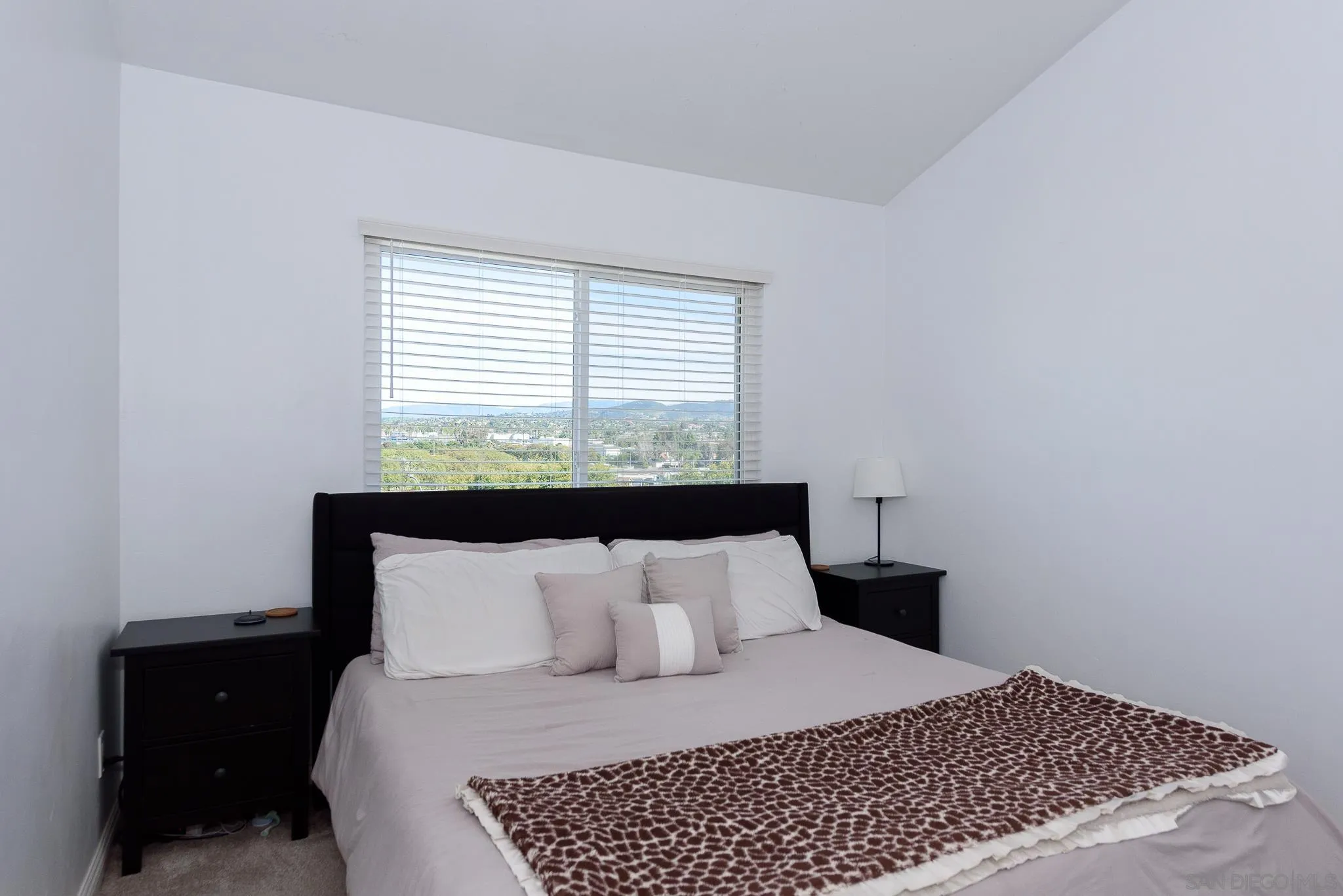 712 Silver Drive Vista, CA 92083 - Photo 22 of 32 a bedroom with a bed and window