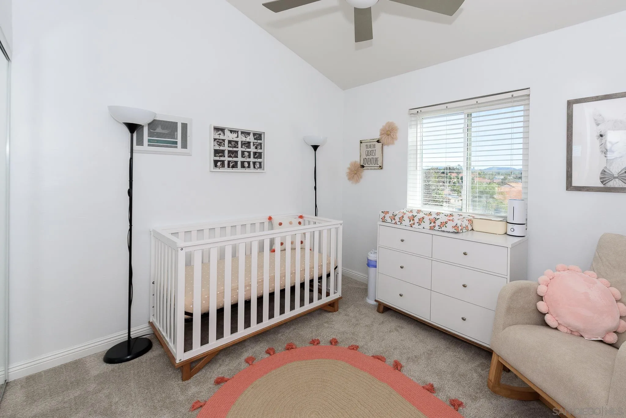 712 Silver Drive Vista, CA 92083 - Photo 26 of 32 a bedroom with a bed and a window