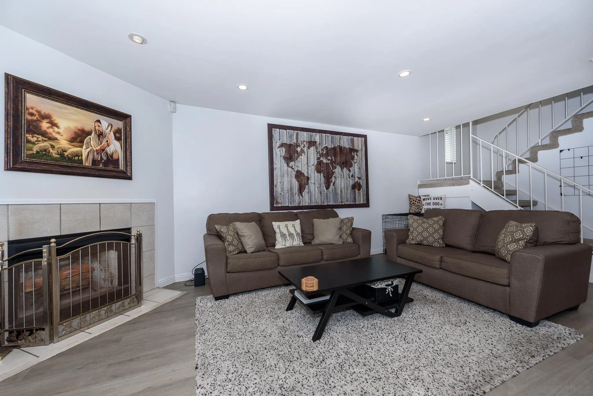 712 Silver Drive Vista, CA 92083 - Photo 29 of 32 a living room with furniture a fireplace and a flat screen tv