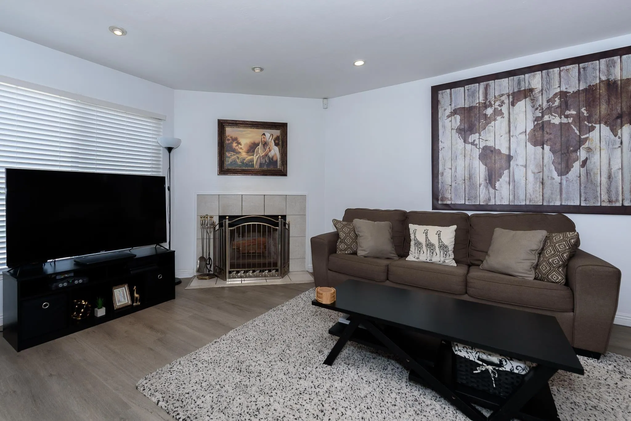 712 Silver Drive Vista, CA 92083 - Photo 30 of 32 a living room with furniture a flat screen tv and a fireplace
