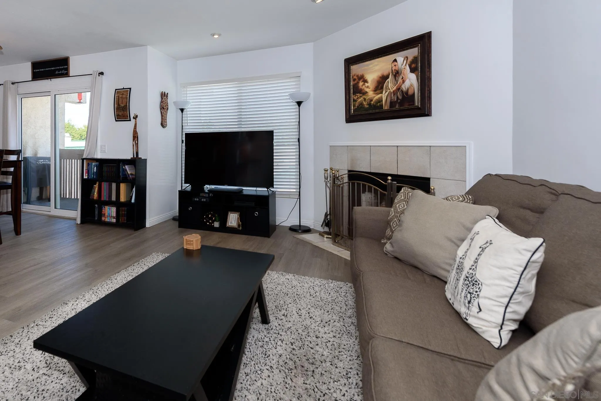 712 Silver Drive Vista, CA 92083 - Photo 31 of 32 a living room with furniture and a flat screen tv