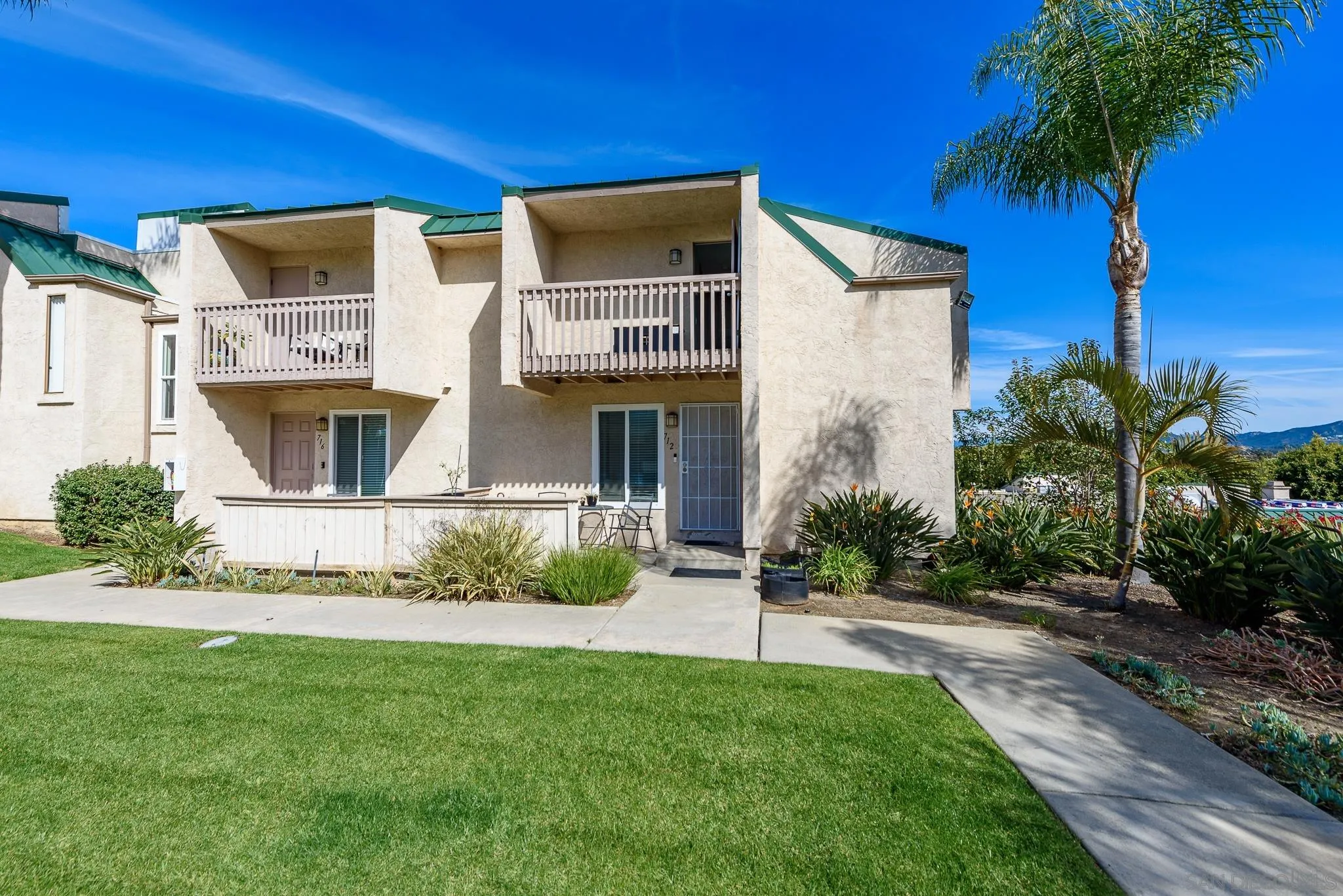 712 Silver Drive Vista, CA 92083 - Photo 4 of 32 a front view of a house with a yard