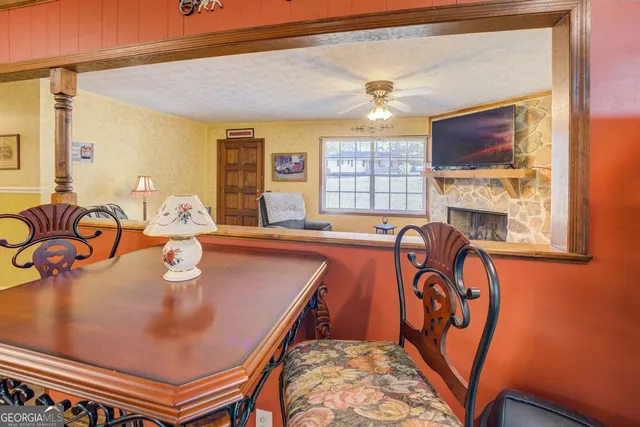 a kitchen with stainless steel appliances granite countertop a sink and wooden floors