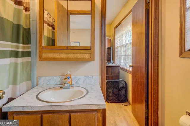 a bed room with a bed and a window