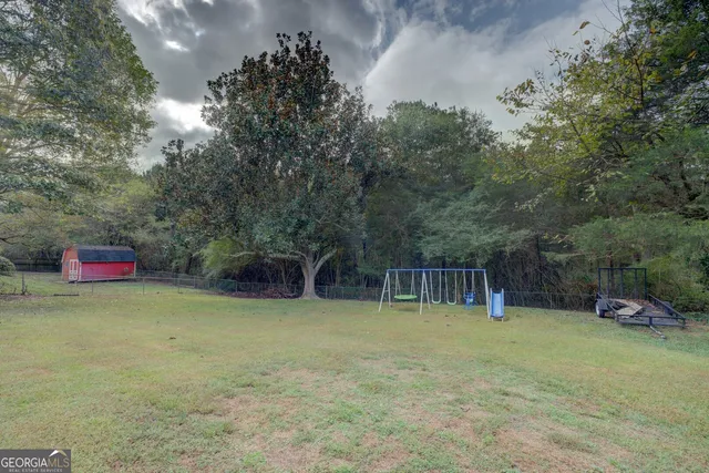 a view of deck with patio and wooden floor