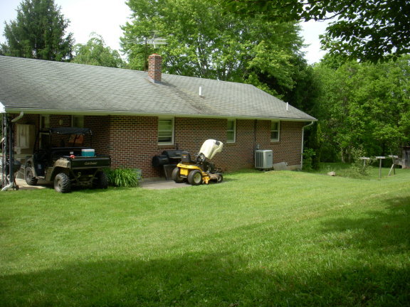 293 Huckleberry Ridge Road Northeast Floyd, VA 24091 - Photo 8 of 29 a house view with a garden space