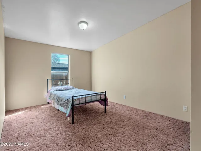 a room with a table and chairs