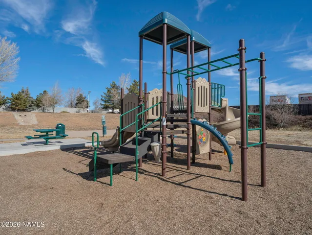a view of a swimming pool with a lounge chair