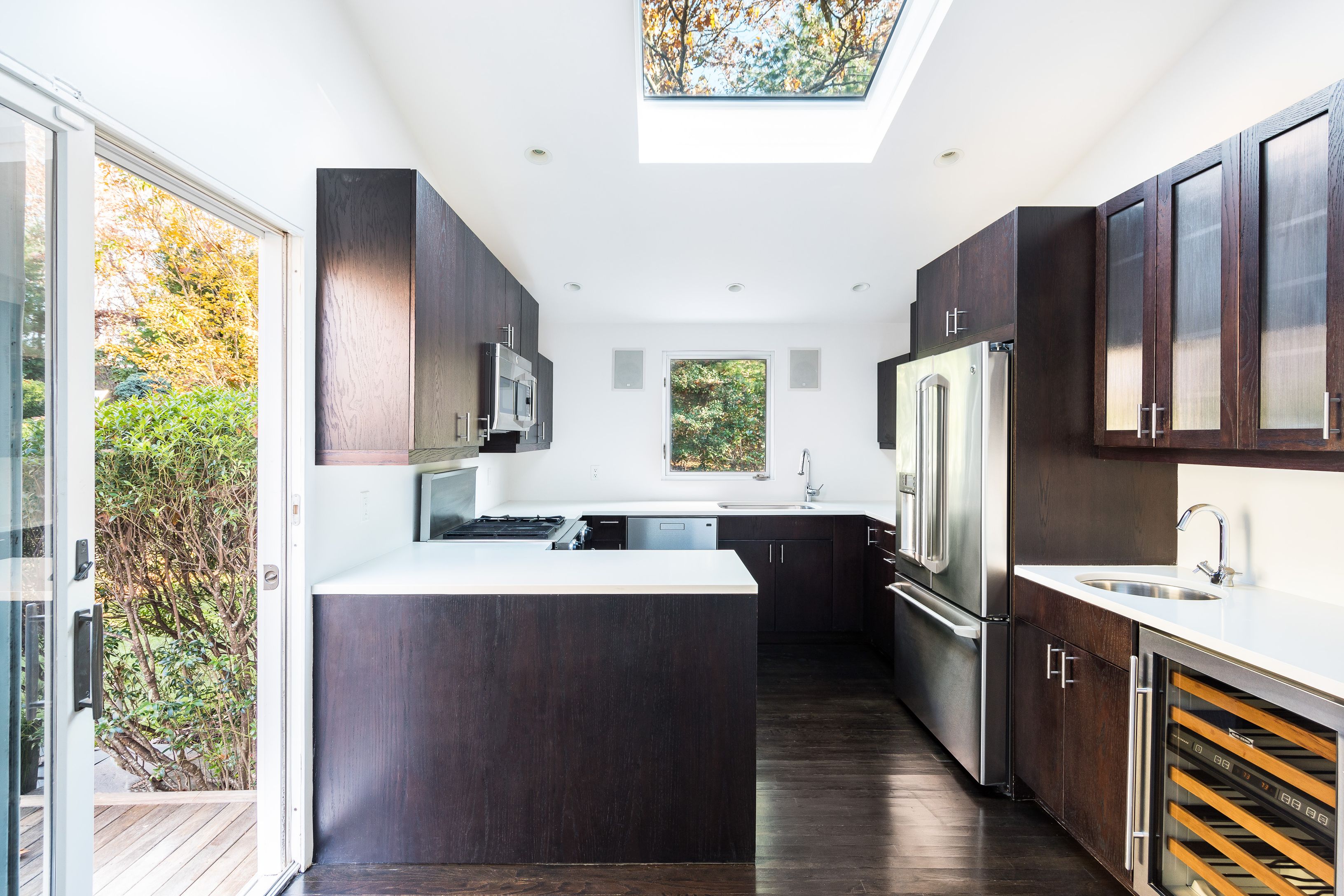 132 Springy Banks Road East Hampton, NY 11937 - Photo 13 of 35 a kitchen with stainless steel appliances a refrigerator sink and wooden floor