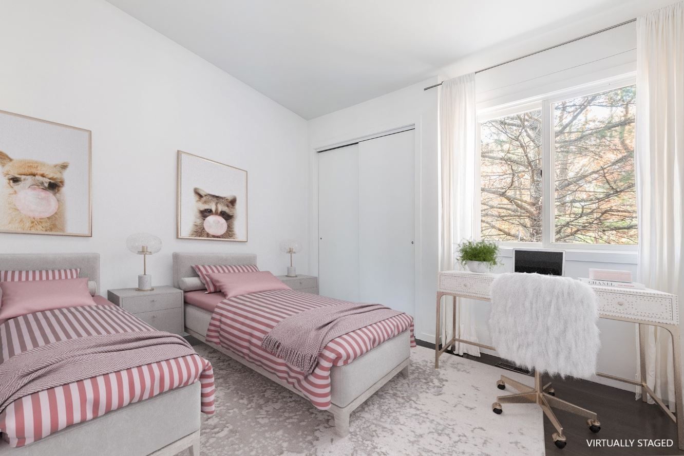 132 Springy Banks Road East Hampton, NY 11937 - Photo 23 of 35 a bedroom with two beds and a large window