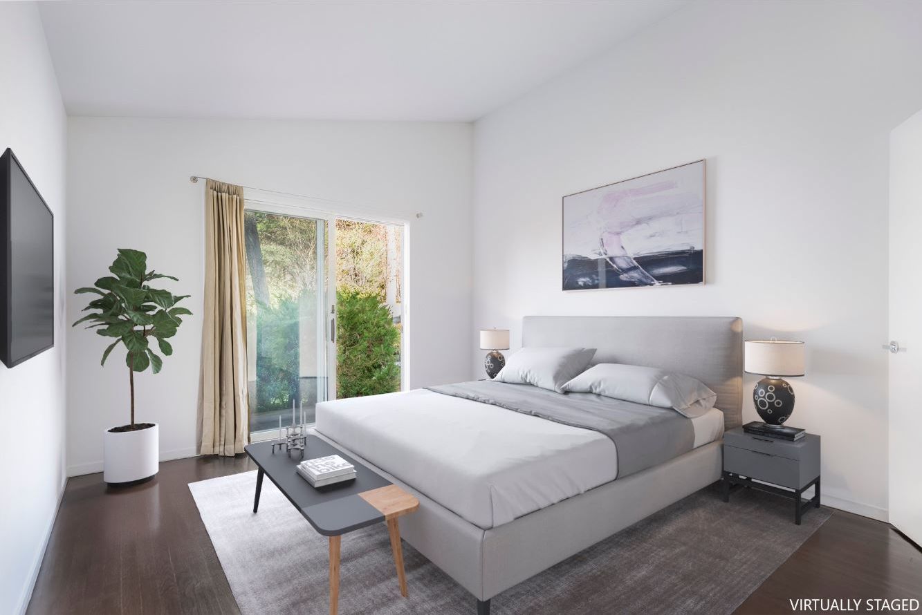 132 Springy Banks Road East Hampton, NY 11937 - Photo 25 of 35 a bedroom with a bed and a potted plant