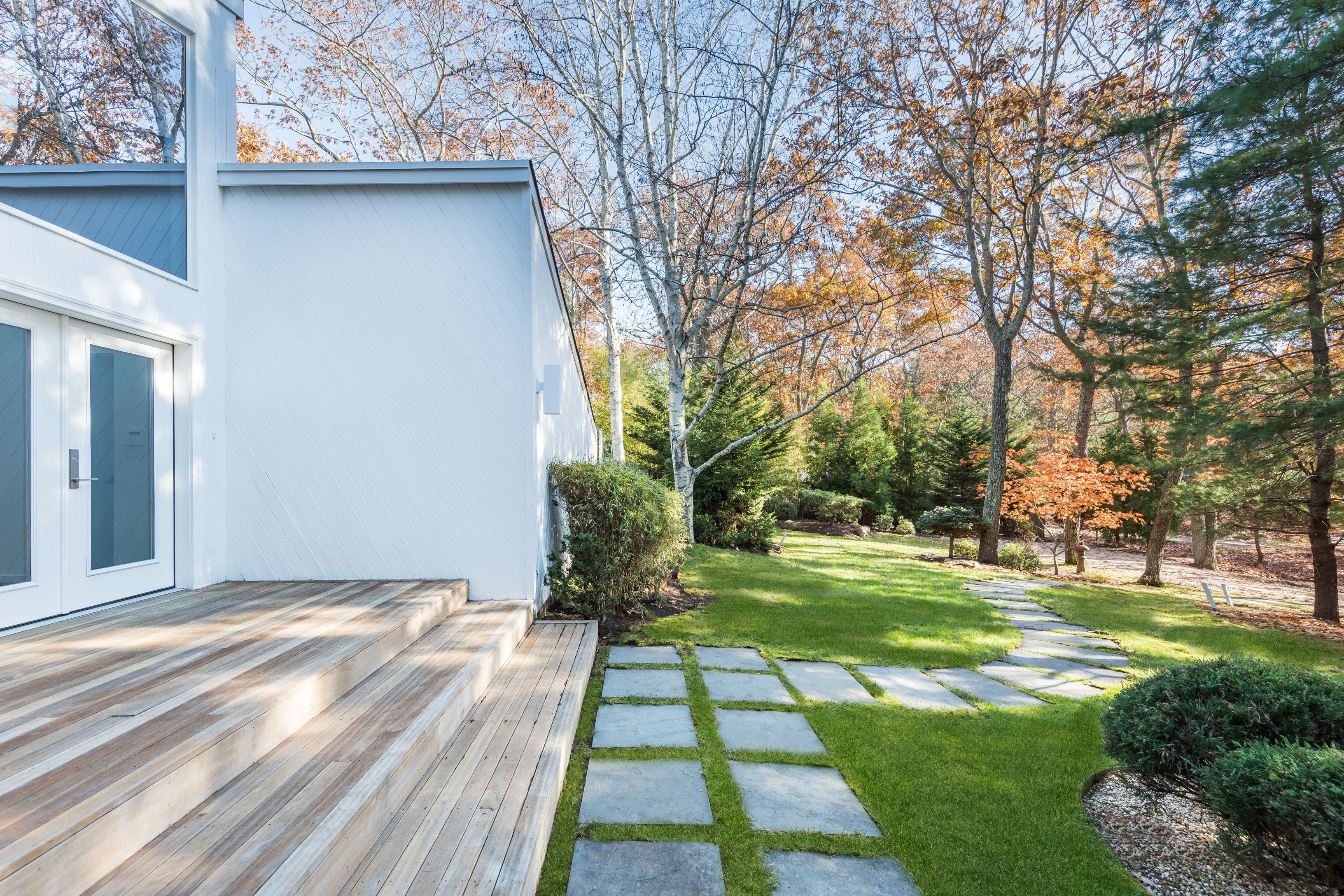 132 Springy Banks Road East Hampton, NY 11937 - Photo 3 of 35 a view of a yard with plants and trees