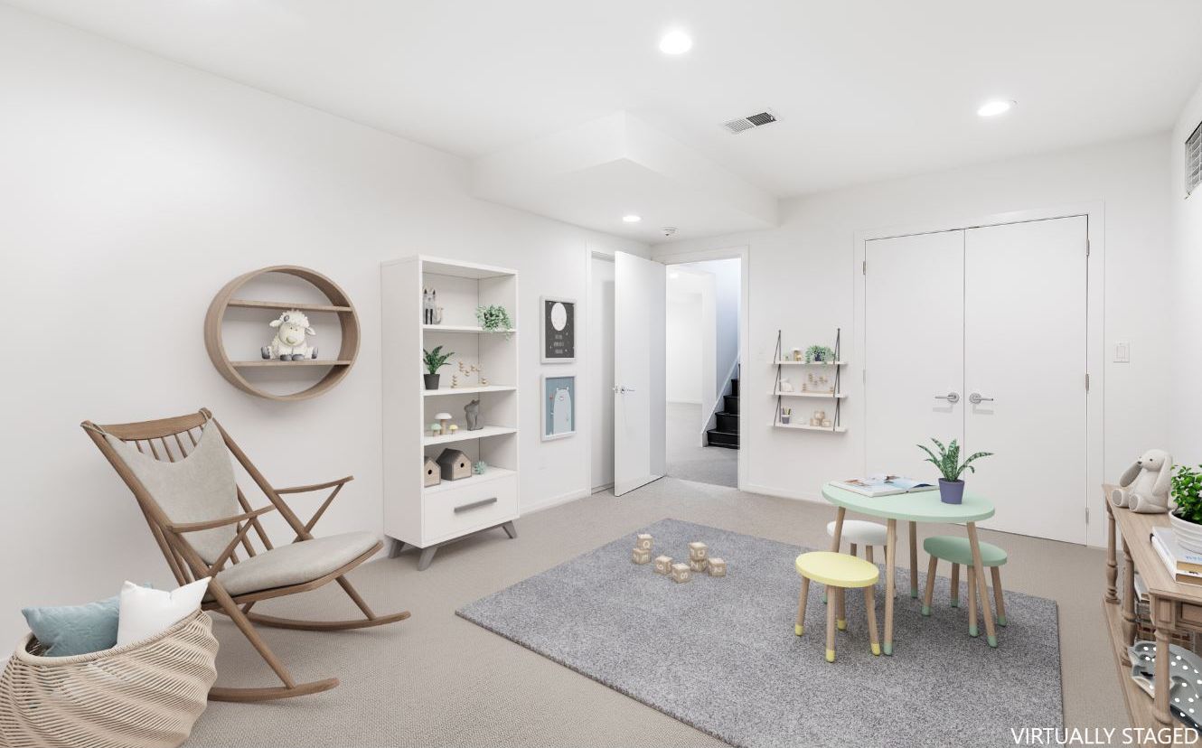 132 Springy Banks Road East Hampton, NY 11937 - Photo 31 of 35 a living room with furniture a clock and a table