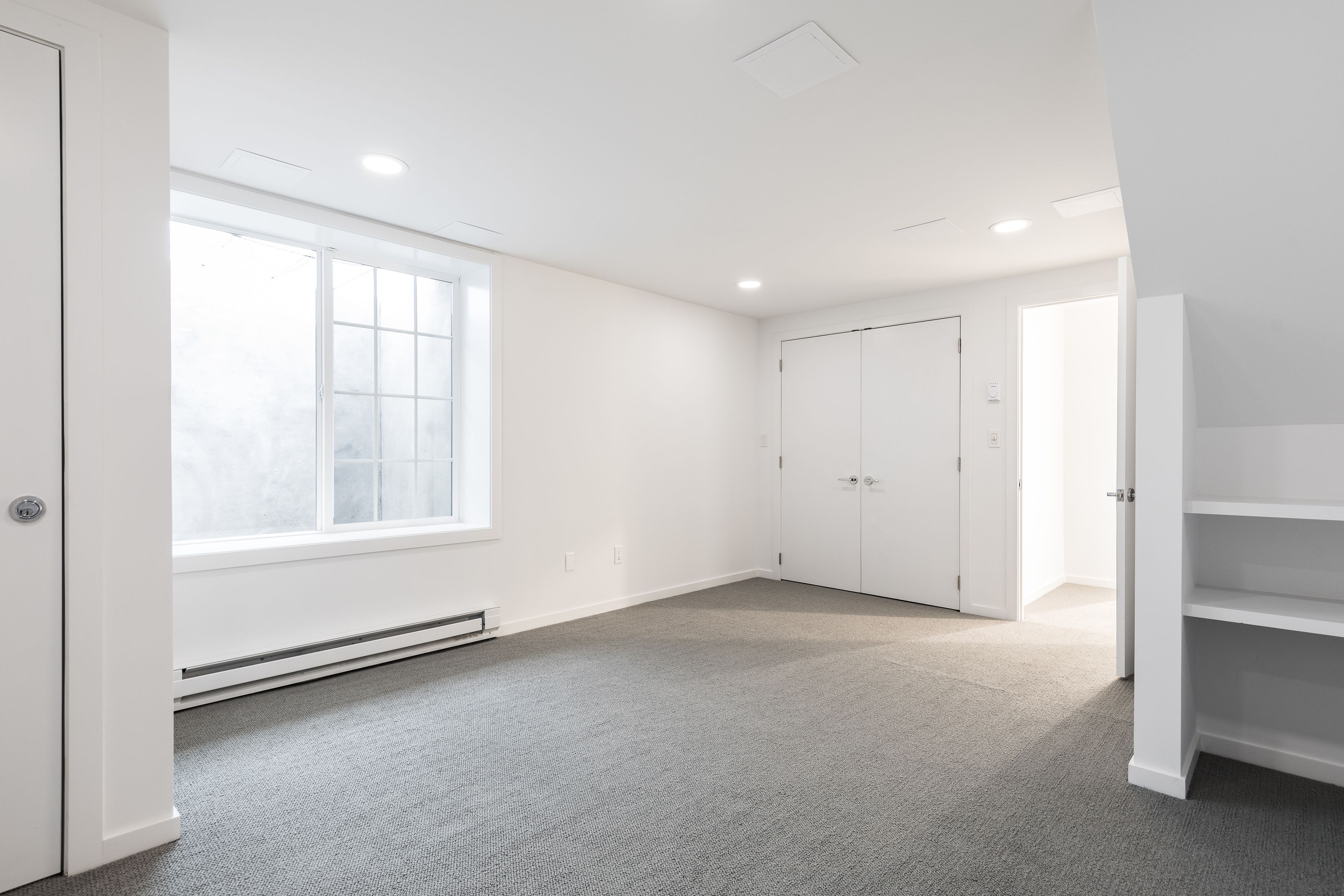 132 Springy Banks Road East Hampton, NY 11937 - Photo 34 of 35 an empty room with windows