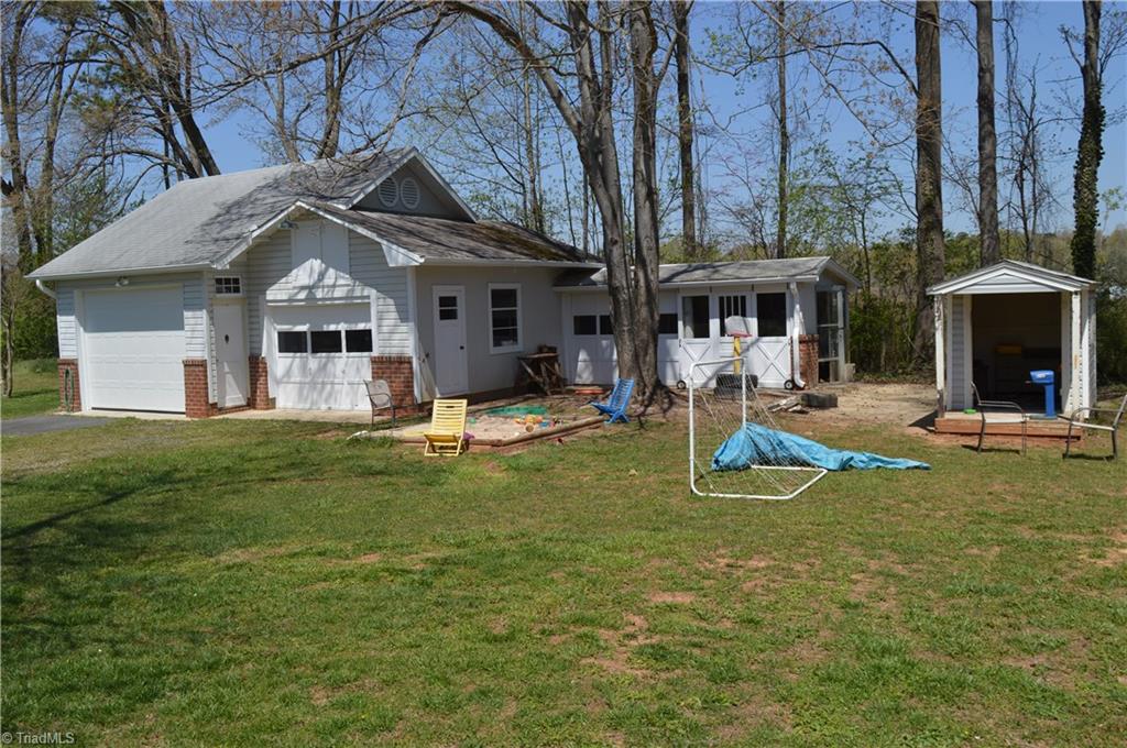 402 Springwood Road Asheboro, NC 27205 - Photo 21 of 21 Detached garage has 2 bays, above storage and more storage. Small playhouse.